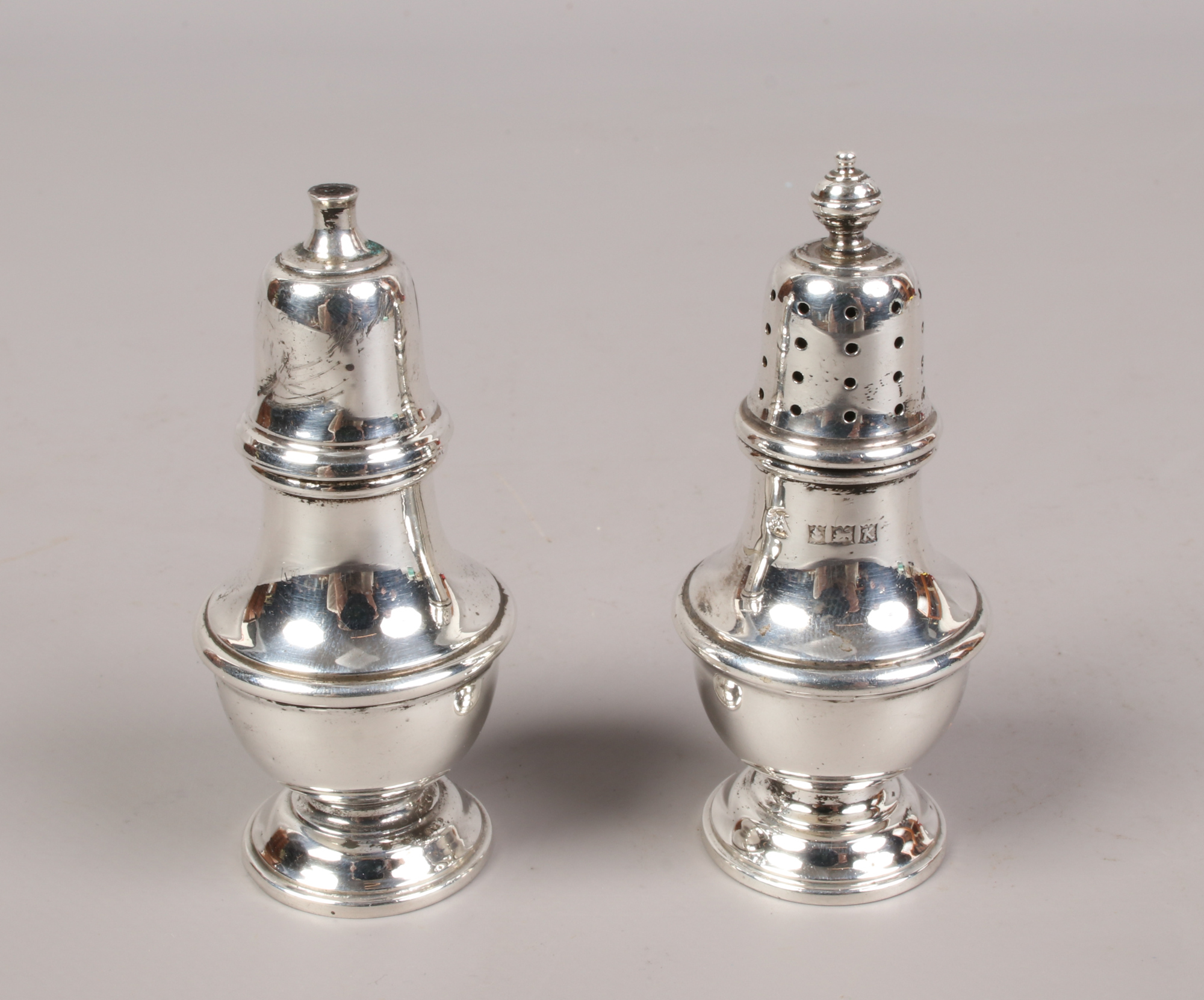 A salt and pepper cruet, assayed Birmingham 1959, 58 grams.