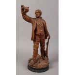 A continental terracotta figure of a tyrolean hunter stamped L & G.