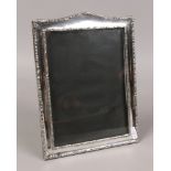 A silver mounted easel photograph frame, assayed Birmingham 1942 by Walker & Hall.