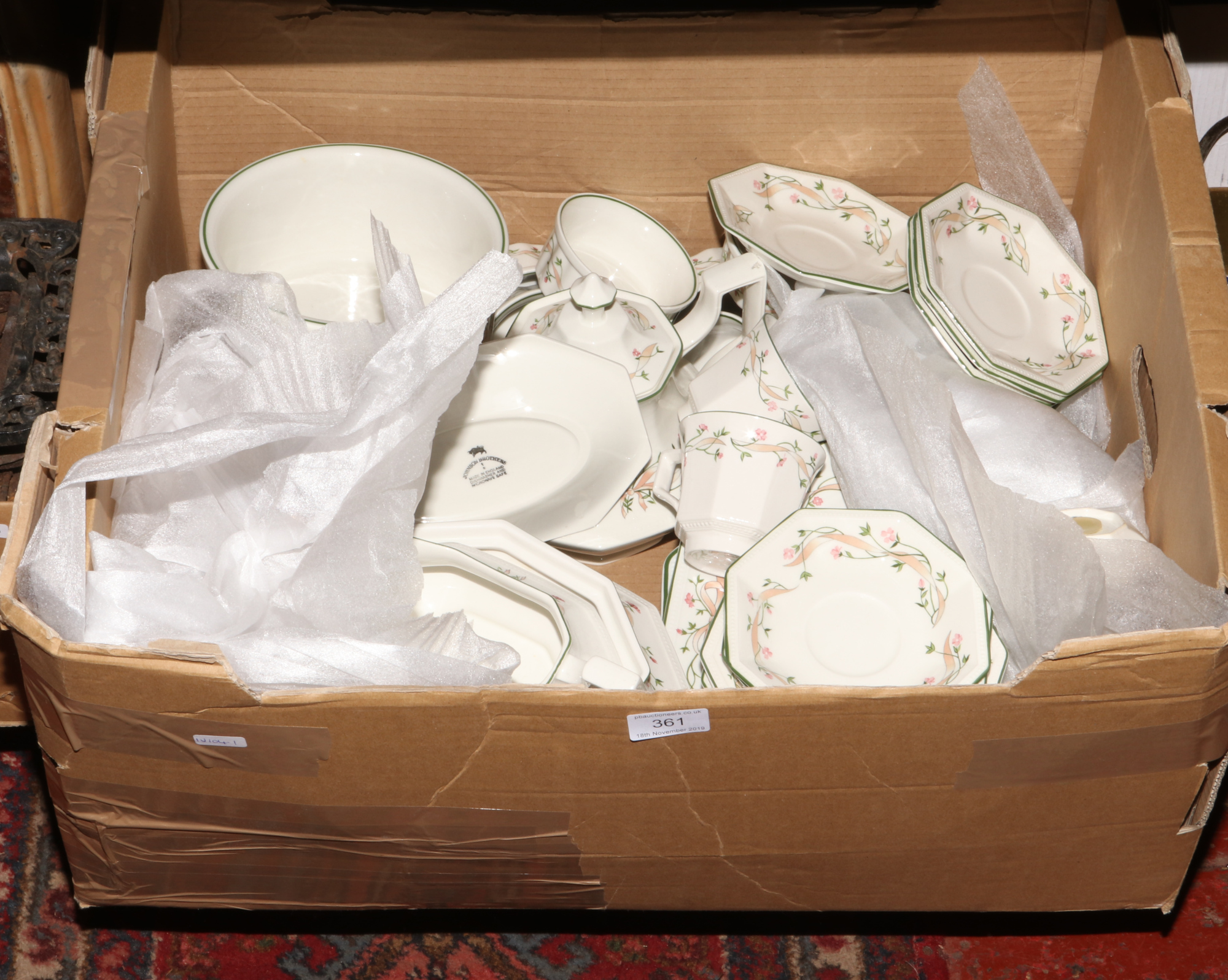 A box of Eternal Beau dinnerwares by Johnson Brothers.