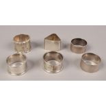 Six silver serviette rings, including two early 20th century examples by Walker & Hall, total weight