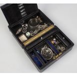 A locking black leather jewellery box containing various silver jewellery including bangles,