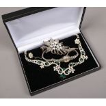 A marcasite Accurist wristwatch, marcasite brooch and a cased necklet and earring set.