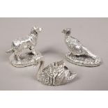 Three filled silver models of animals, Dog, Pheasant and Swan.