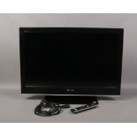 A Sony Bravia flat screen 32 inch television model number KDL 32D300 with remote control and power