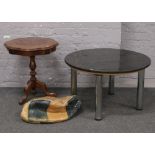 An unstuffed leather pouffe, inlaid mahogany tripod occasional table along with a marble effect