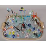 A tray of hand blown coloured glass models of animals, fish and insects.Condition report intended as