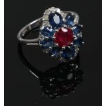 A 9ct white gold sapphire, ruby and diamond cluster set dress ring, size N.