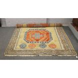 A yellow ground wool rug with geometric design and central medallion.