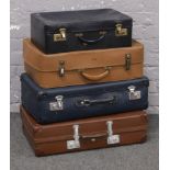 Four vintage suitcases to include antler, globetrotter and revelation examples.