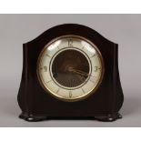 A Bakelite cased Smiths 8 day mantle clock with part silvered dial chiming on a coiled gong complete
