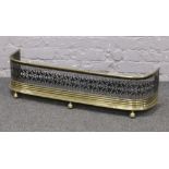 A Victorian pierced brass and steel nursery fire fender.