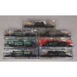 Seven boxed Diecast models of steam trains.