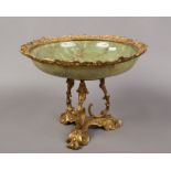 An onyx and gilt metal pedestal bowl raised on a trefoil figural stand.Condition report intended