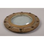 A brass cased ships porthole window.