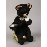 A vintage battery powered mechanical Pepsi Cola drinking bear.