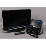 A Panasonic LCD TV model TX - 26 x 10B along with a portable Panasonic DVD player in carry bag, TV