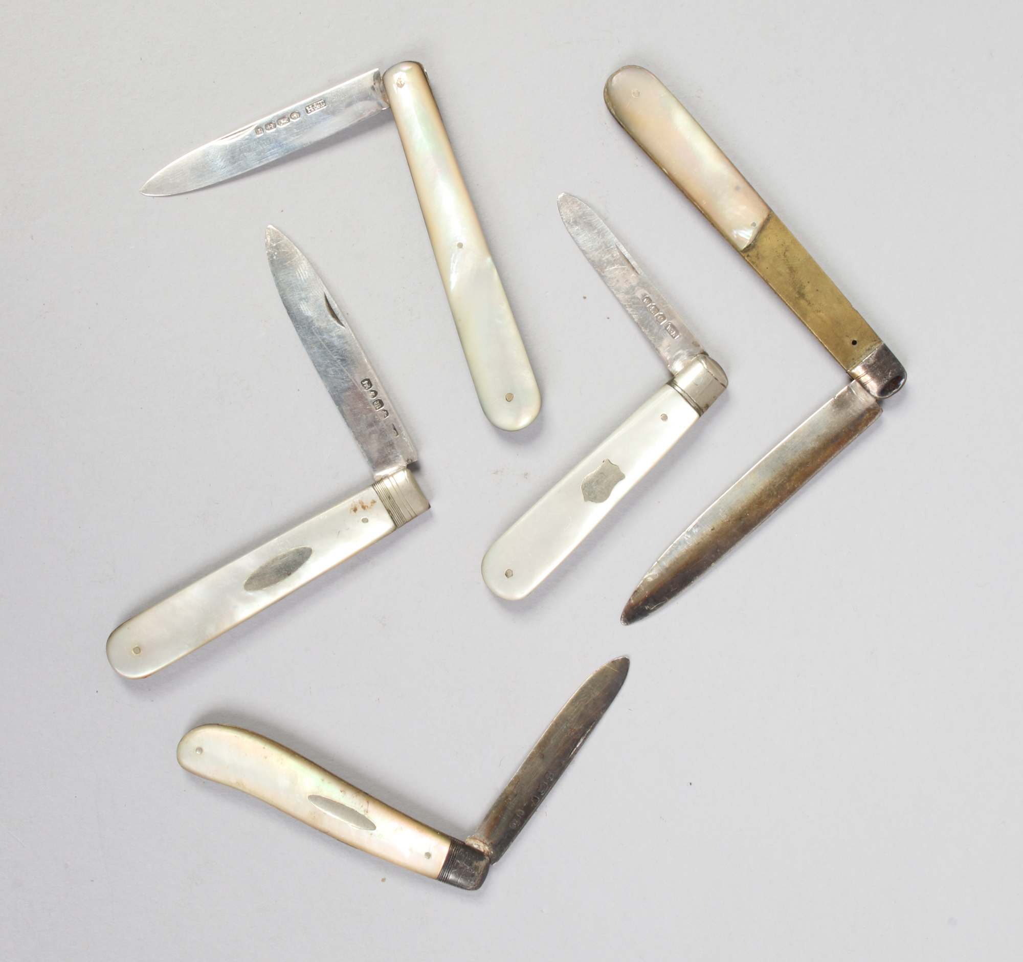 Five silver fruit knives, all having mother of pearl scales, including Victorian examplesCondition