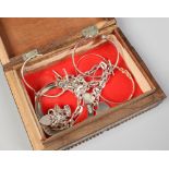 An Indian inlaid box containing a quantity of silver jewellery including bangles, bracelets,