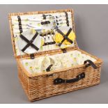 A basket ware picnic hamper and contents four persons.