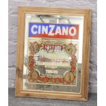 A framed Cinzano Vermouth advertising mirror.
