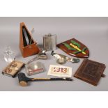 A box of collectables to include railway badges, hip flask, Irish Shillelagh etc.