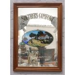 A framed Southern Comfort advertising mirror.
