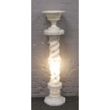 An illuminating alabaster torchere stand and matching pedestal urn.