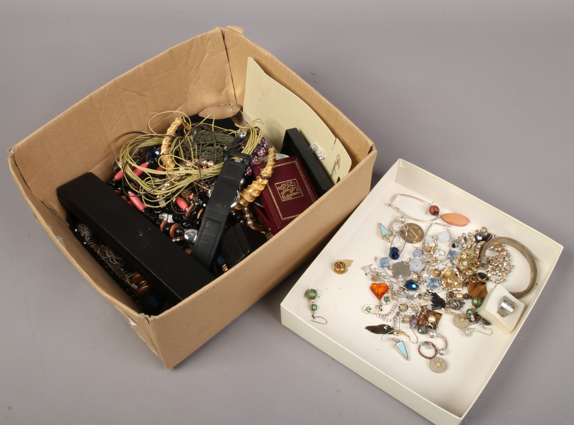 A box of costume jewellery earrings, necklaces, rings etc.