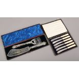 A cased set of silver fish servers Kings pattern and a cased set of silver plated tea knives with