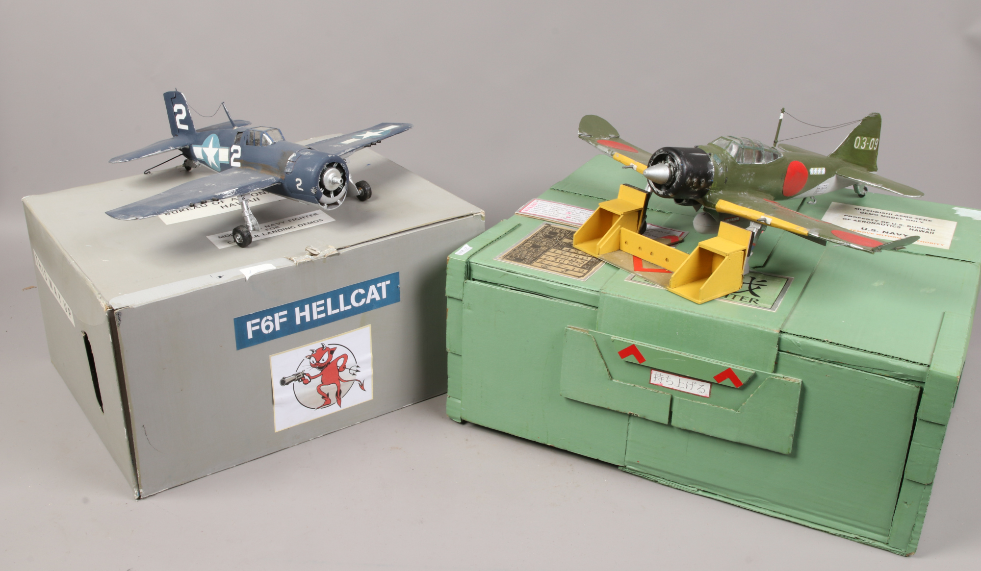 Two scratch built models of military aircraft, F6F Hellcat and Mitsubishi A6MS Zeke.