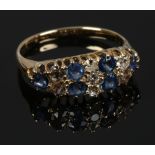 An 18ct gold 13 stone sapphire and diamond ring, size M.