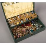 A jewellery box of costume jewellery to include beads, bangles, earrings, brooches etc.