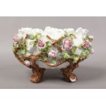 A Meissen style poise bowl decoration with applied flowers, cross sword mark to base.