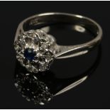 An 18ct gold sapphire and diamond cluster ring, size L1/2.
