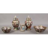 A pair of Cantonese famille rose lidded urns, along with two matching bowls and with six character