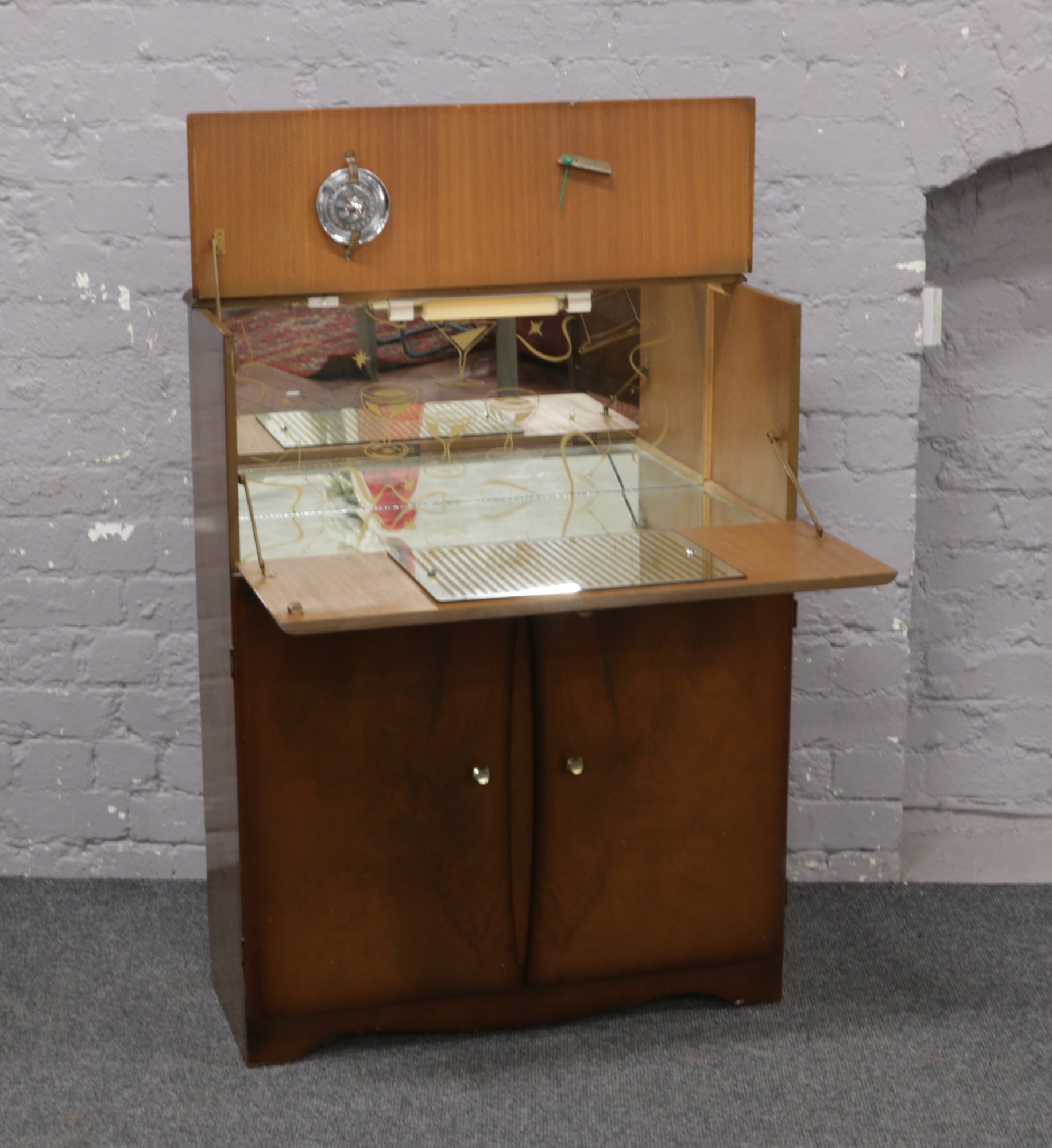 A mahogany cocktail cabinet.