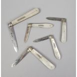 Five silver fruit knives all having mother of pearl scales, including Victorian examples.