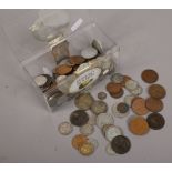 A box of pre-decimal silver and copper coins.