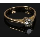 An 18ct gold and platinum diamond solitaire ring, size K.