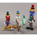 Three hand blown Murano glass models of clowns, along with a similar art glass model of a Horse