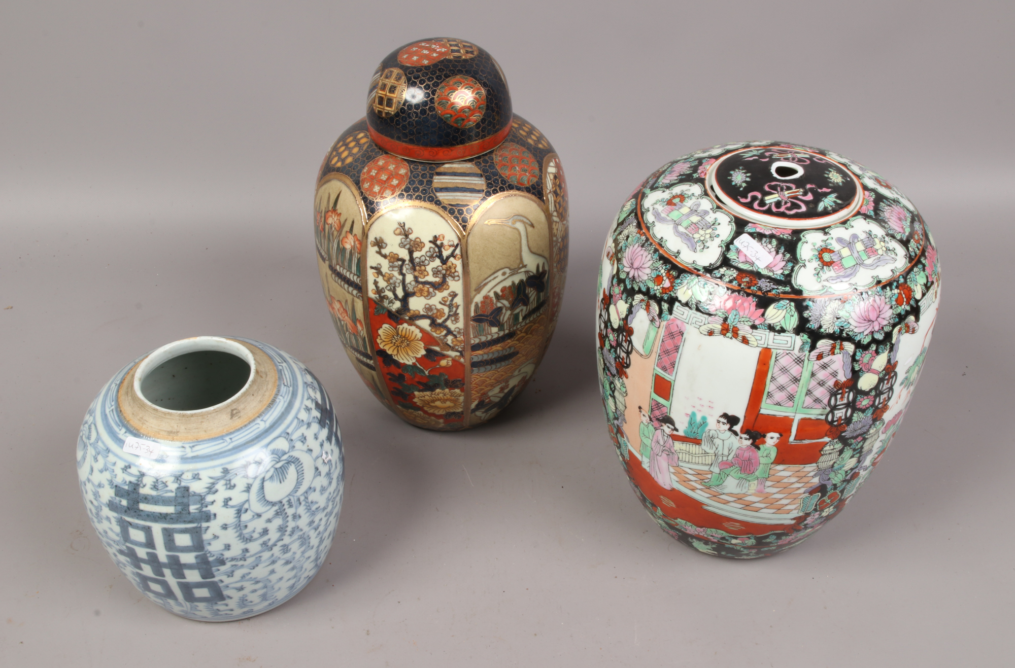 A provincial 18th century Chinese blue and white ginger jar and two modern decorative Chinese jars.