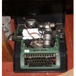 A cased silver reed 500 typewriter, along with a Pentax MZ - 50 35mm SLR camera and a Beirette