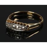 An 18ct gold five stone diamond ring in boat shaped setting, size P.
