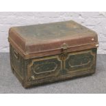 A twin handled tin trunk.