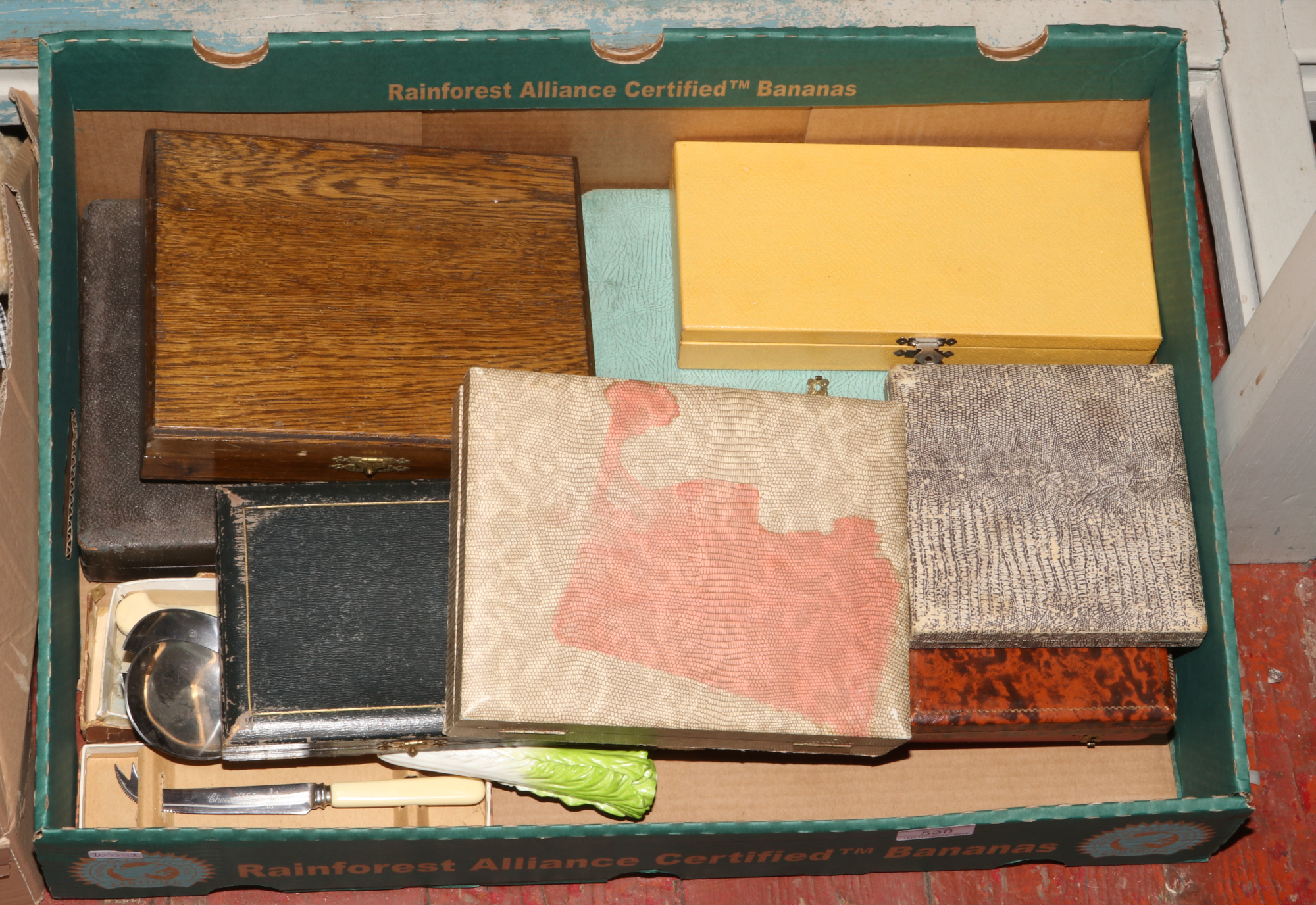 A box of cased and loose flatwares to include cased teaspoons, cake knife etc.