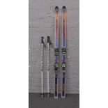 A pair of Dynastar skis and poles.