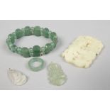 A collection of jade / hardstone jewellery including two pendants on carved as a buddha.