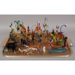 A tray of hand blown coloured glass models of animals, fish and birds.