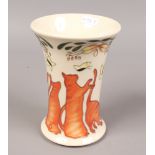 A Moorcroft tublined Lucky vase 16cm high x 11cm diameter depicting six ginger cats in various poses